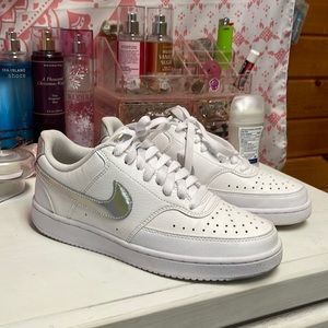 White Nikes with silver